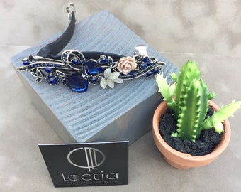 Loctia lined blue rhinestone barrette hair clip.