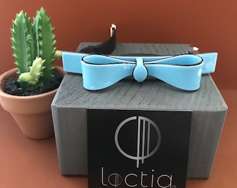 Loctia lined no slip light blue acetate bow, medium barrette hair clip with black accents good for fine hair