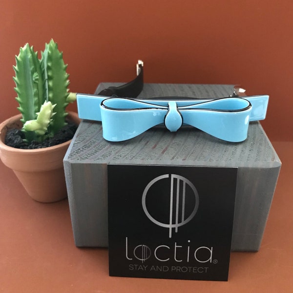 Loctia lined no slip light blue acetate bow, medium barrette hair clip with black accents good for fine hair