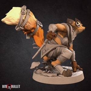May include: A grey and orange painted miniature figurine of a fox-like creature with a large, bushy tail. The creature is wearing armour and holding a sword. The figurine is standing on a base with a mushroom and rocks.