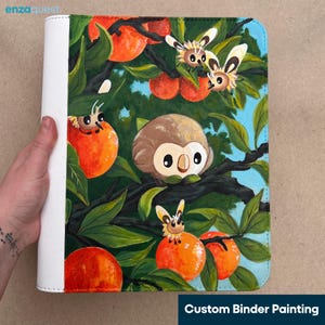 May include: A white binder featuring a painted illustration of a brown round owl-like creature perched on a dark tree branch surrounded by bright orange fruits and small winged insect-like creatures with yellow and brown markings among green leaves.