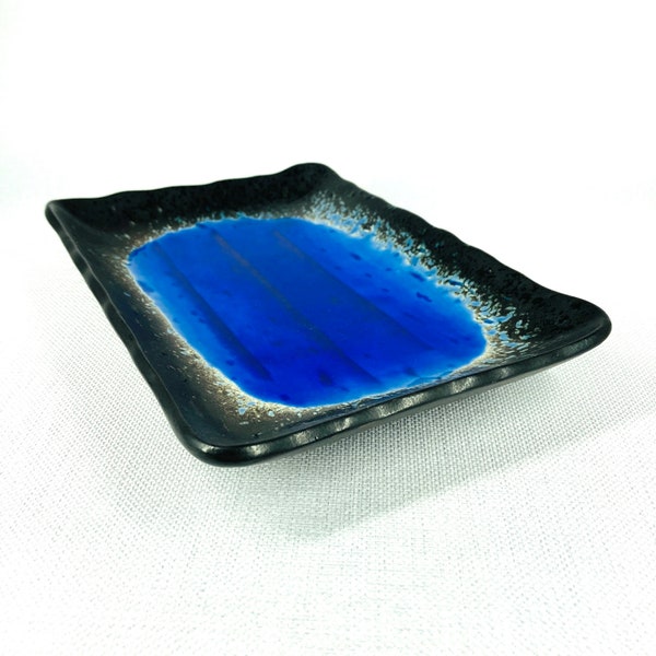 Studio pottery dish. Blue with black rim