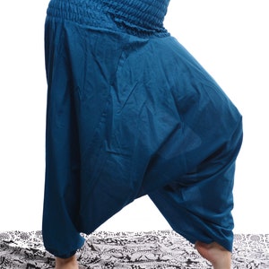 May include: Teal blue cotton harem pants with a gathered elastic waistband.