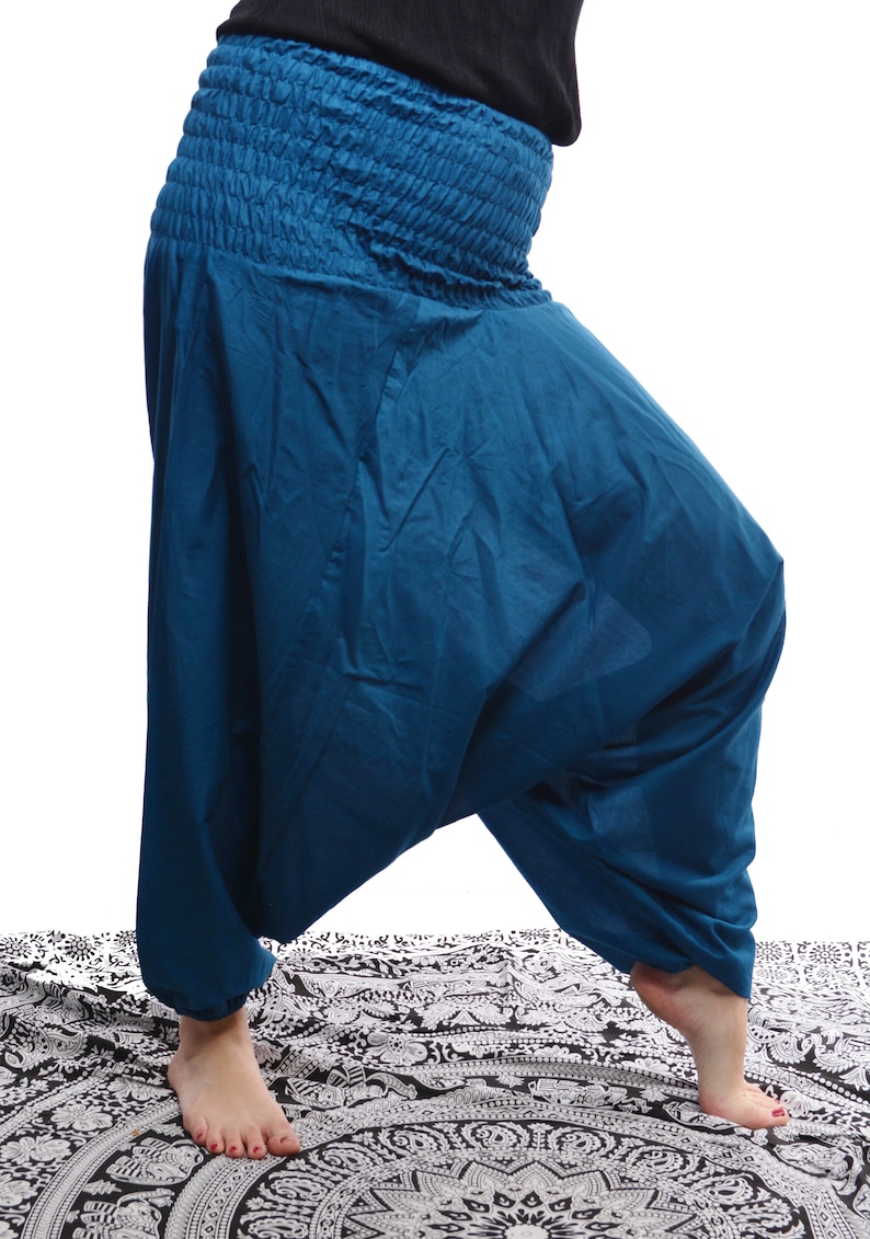 May include: Teal blue cotton harem pants with a gathered elastic waistband.