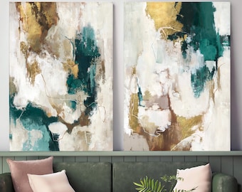 May include: Two rectangular canvas wall art pieces featuring abstract brushstrokes in shades of deep teal, metallic gold, warm brown, and cream. The composition displays layered textures and fluid, organic shapes across both panels.