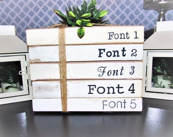Personalized farmhouse family name stamped books, book stacks with twine, white modern farmhouse table decor