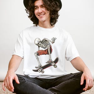 Skater Skeleton T-shirt | Unisex Garment-Dyed Skull Skateboard Tee | Cool Halloween Graphic Shirt