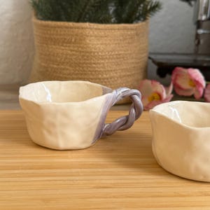 Espresso set of two cups.  Handmade coffee set of cups. Lilac and white ceramic cup . Pinch pot technique, braided handle.