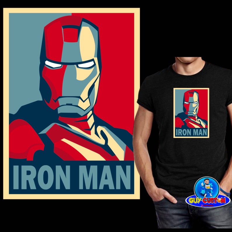 Puede incluir: Una camiseta negra con un dise&ntilde;o gr&aacute;fico rectangular del casco de Iron Man en rojo, gris y azul, con el texto "IRON MAN" debajo. El dise&ntilde;o recuerda a un cartel de propaganda. Una versi&oacute;n m&aacute;s grande del cartel est&aacute; a la izquierda.