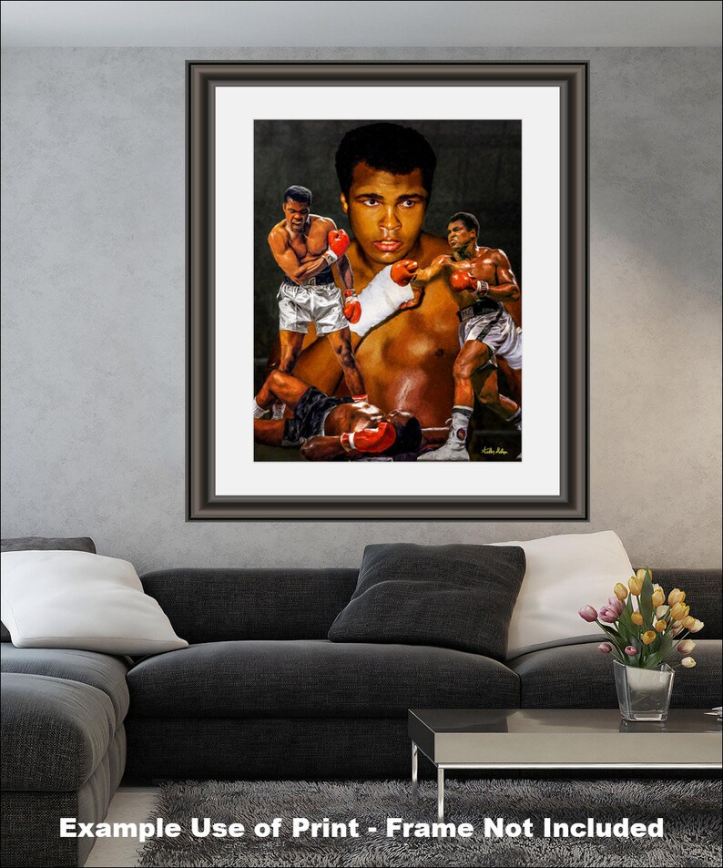 May include: A framed print of a black and white illustration of a boxer. The boxer is shown in three different poses, with a red boxing glove in each hand. The background is a dark gray.