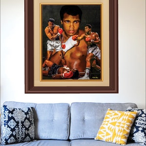 May include: A colorful painting of a boxer in a boxing ring. The boxer is wearing red boxing gloves and a white boxing robe. The painting is in a brown frame.