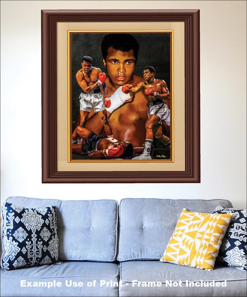 May include: A colorful painting of a boxer in a boxing ring. The boxer is wearing red boxing gloves and a white boxing robe. The painting is in a brown frame.