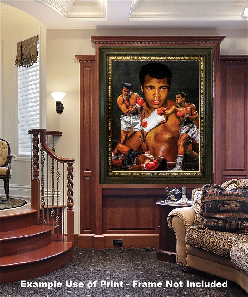 May include: A framed print of a painting depicting a boxing scene with three boxers. The main boxer is in the center of the image and is wearing red boxing gloves. The print is hanging on a wall in a home interior setting.