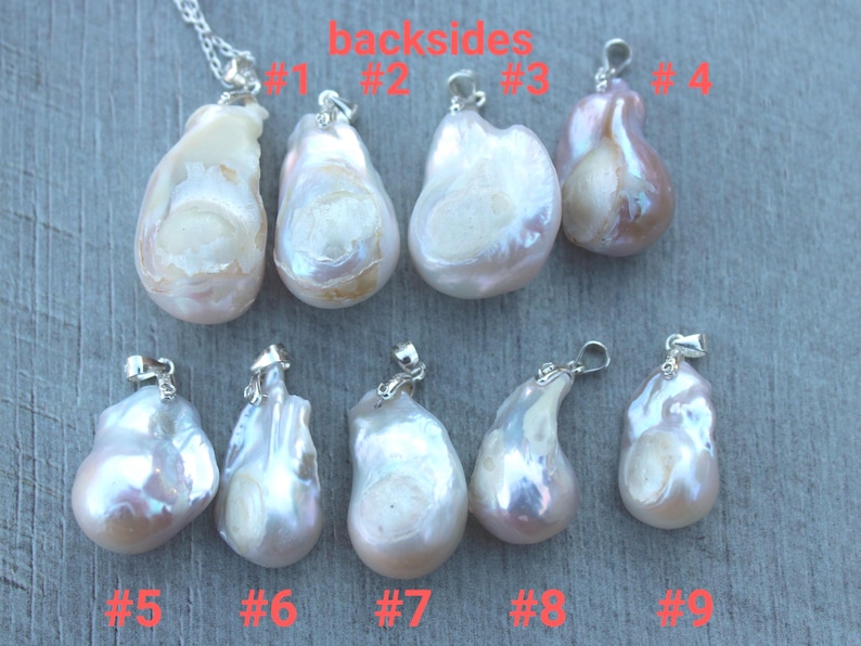 May include: Nine white and pink baroque pearl pendants with silver bails. The pearls are all different shapes and sizes. The pearls are labelled #1 through #9.