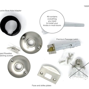 May include: A door knob installation kit labeled 1900R-BN1, including a black bore hole adapter, two circular brushed nickel rosettes, a premium passage latch, a face plate, a strike plate, matching screws, and a glass knob with a black X mark.