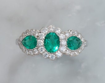 Triple 0.98ct Emerald And Diamond Cluster Ring