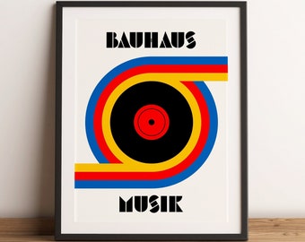 May include: A black and white poster with a colorful graphic of a record with the text "Bauhaus Musik" in bold black letters.