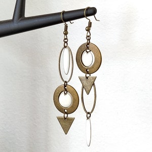 Asymmetrical bronze earrings round shuttle sequins connector and white round oval triangle