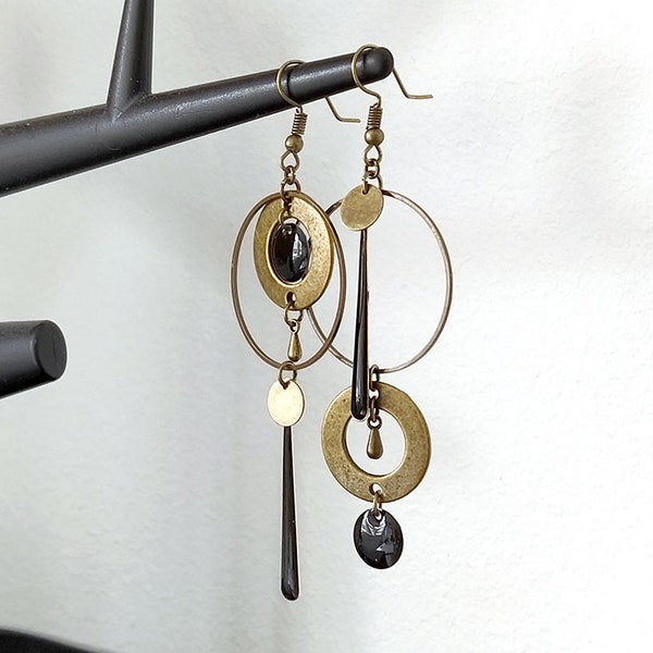 Asymmetrical bronze earrings with long black or white sequins, round connector, circle, teardrop