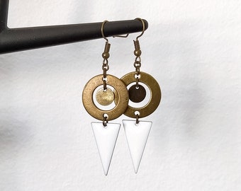 May include: Gold and white geometric earrings with a circle and triangle design.