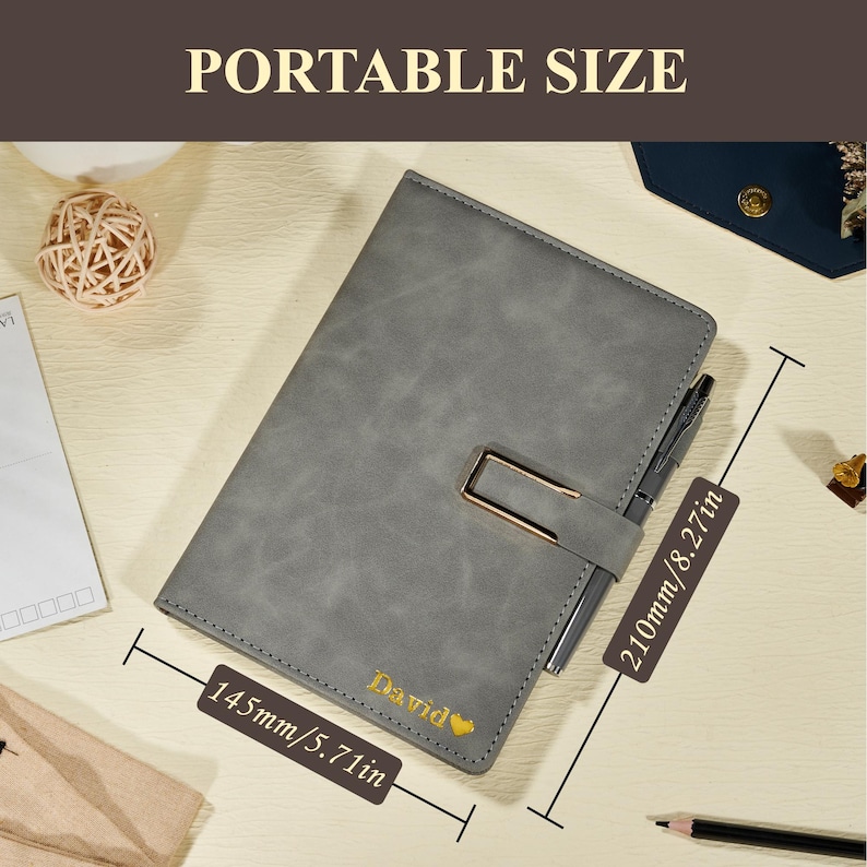 May include: Gray leather-look notebook with a gold-colored clasp and pen holder. The notebook is labeled "David" in gold lettering and measures 5.71 inches wide and 8.27 inches long. The text "PORTABLE SIZE" is at the top.