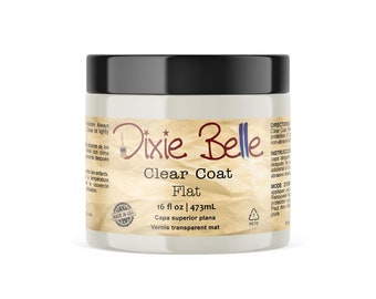 May include: A 16-ounce jar of Dixie Belle Clear Coat Flat finish. The jar is white with a black lid and a brown paper label with the Dixie Belle logo and product information. The label also includes the text "Made in USA".
