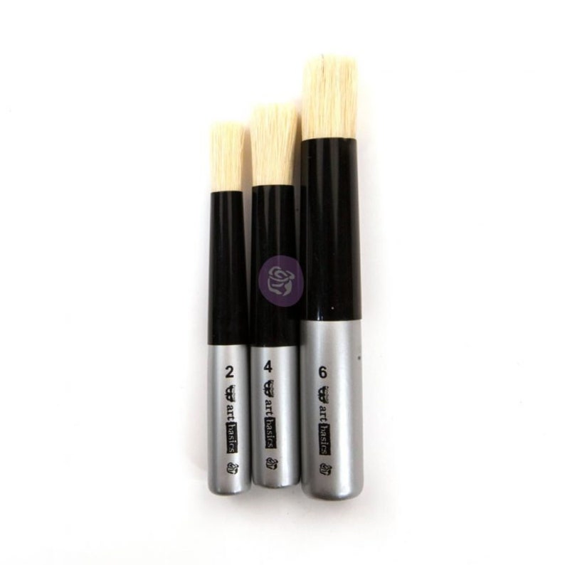 May include: Set of three round paint brushes with black handles and silver bands. The brushes are labeled "2 art basics", "4 art basics", and "6 art basics".
