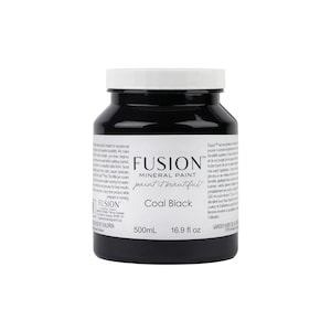 May include: A black bottle of Fusion Mineral Paint in the color Coal Black. The bottle is labeled with the brand name, paint type, and color name. The bottle contains 16.9 fluid ounces (500 milliliters) of paint.