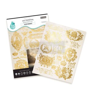 May include: A pack of H2O Transfers water decals and a sheet of gold-coloured decals. The package reads "Gilded Memories" and features gold-coloured ornate designs, including crowns, frames, and floral elements. The decals work on various surfaces.