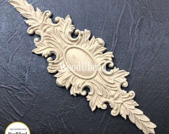 May include: A decorative wooden ornament with an oval center and intricate floral designs. The ornament is made of light-colored wood and has a smooth, polished finish. The ornament is perfect for adding a touch of elegance to any home decor.