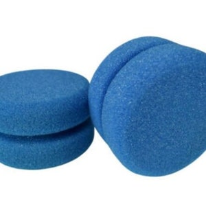 May include: Two blue sponge applicators, one is a single round sponge and the other is a double round sponge.