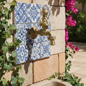 May include: A white ceramic mug with a black handle and the text "But first, coffee" in a handwritten style. The mug is on a white surface.