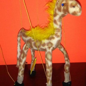 Giraffes  these majestic animals brought to life as puppets. Kids love these safari animals. Imagination playtime. Hours of fun.
