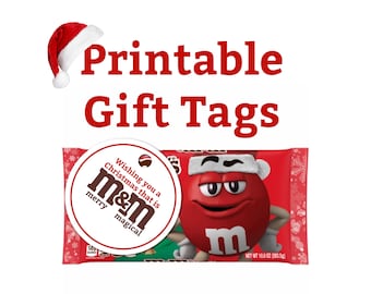 May include: Printable gift tags with a red Santa hat and a red M&M's character wearing a Santa hat. The gift tag design includes the text "Wishing you a Christmas that is merry & magical" and the M&M's logo.