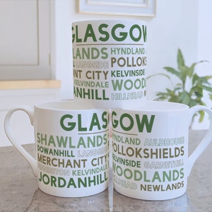 Glasgow bone china mug with local areas including Shawlands Woodlands Hillhead and Kelvinside. Glasgow gift designed & printed in Scotland