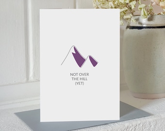 Mountain climbing birthday card - "not over the hill (yet)". Designed & printed in Scotland on recycled card with plastic free packaging