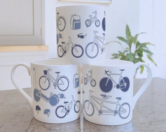 Cycling fine china mug, gift for cyclists. Featuring a road bike, mountain bike, recumbent and tandem. Designed and printed in Scotland