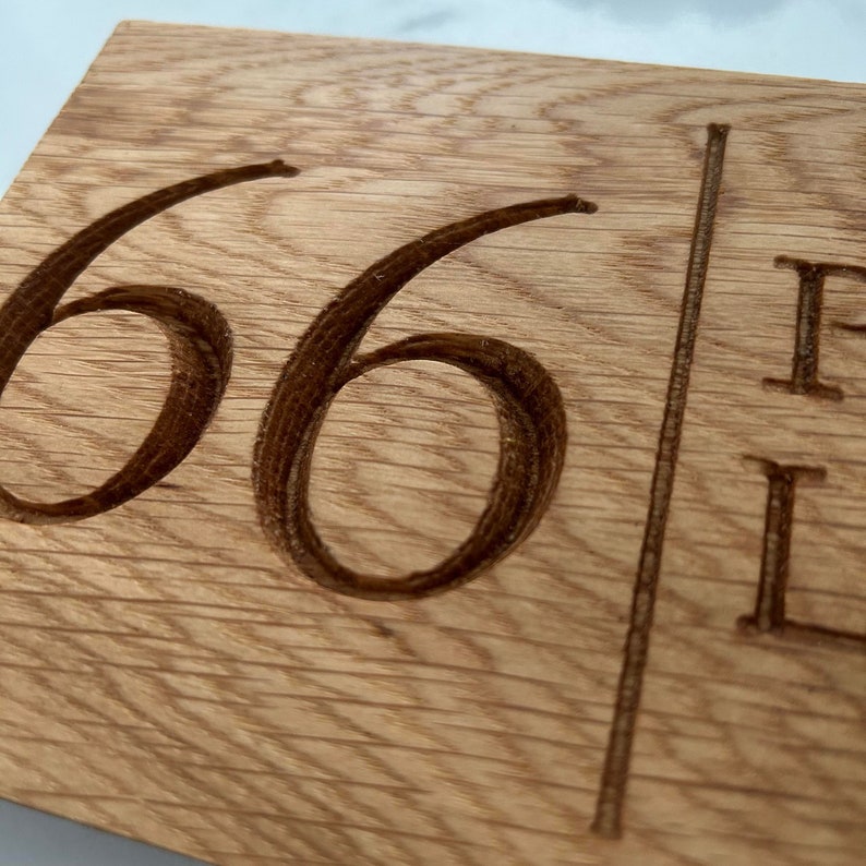 Custom French oak sign with engraved text, ideal for home decor or as a thoughtful gift. Beautifully handcrafted, this sign can be personalized with your choice of words. Durable, rustic, and timeless in design, perfect for any space."