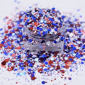 May include: A clear jar filled with red, white, and blue glitter. The glitter is a mix of small and large pieces, and it is perfect for crafting or decorating.