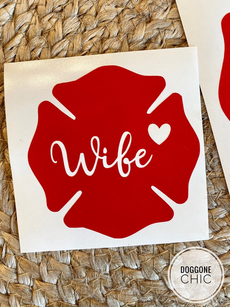 May include: Red fire hydrant sticker with the word "Wife" in white cursive lettering and a small white heart.