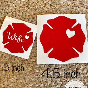 May include: Two red fire hydrant decals with white outlines. The smaller decal is 3 inches and says "Wife" with a small white heart. The larger decal is 4.5 inches and has a white heart in the centre.