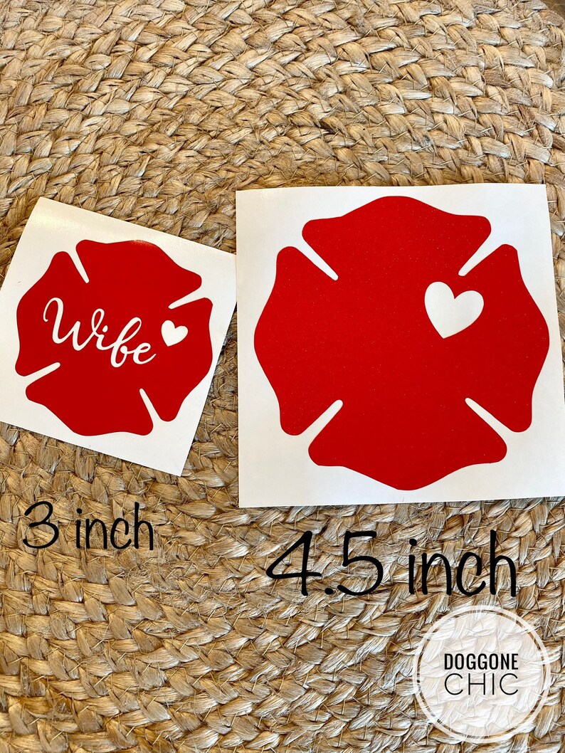 May include: Two red fire hydrant decals with white outlines. The smaller decal is 3 inches and says "Wife" with a small white heart. The larger decal is 4.5 inches and has a white heart in the centre.