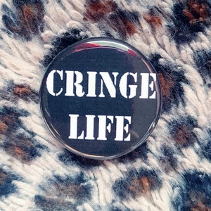 May include: A black button with white text that reads "Cringe Life".
