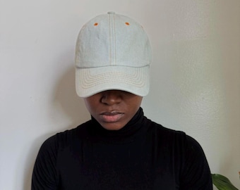 Vintage baseball cap with orange stitching in light blue