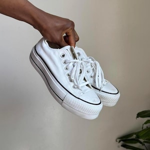 May include: A set of three ceramic mugs with a speckled, matte finish. The mugs are in shades of cream, light gray, and dark gray. Each mug has a simple, minimalist design and a rounded handle. The mugs are suitable for coffee, tea, or other beverages.