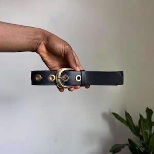 Black grommet belt with gold buckle size S