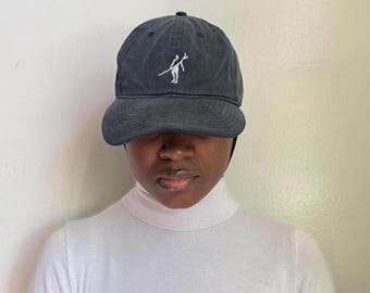 Vintage black faded adjustable baseball cap with white logo