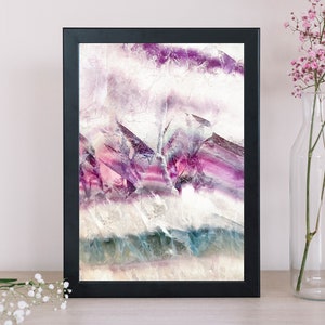 May include: Framed abstract art print featuring a close-up of purple, pink, and white fluorite crystal with a textured surface.