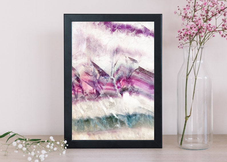 May include: Framed abstract art print featuring a close-up of purple, pink, and white fluorite crystal with a textured surface.