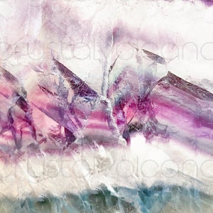 May include: Close-up of a purple, pink, and white fluorite crystal with a layered, striated pattern. The crystal has a translucent, almost iridescent quality.